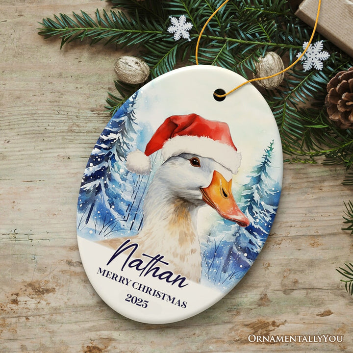 Goose with Santa Hat Personalized Ornament, Winter Forest Christmas Gift With Custom Name and Date Ceramic Ornament OrnamentallyYou Oval