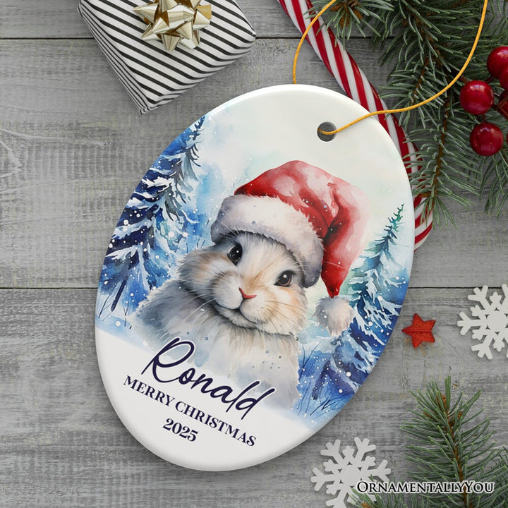 Cute Bunny with Santa Hat Personalized Ornament, Winter Forest Christmas Gift With Custom Name and Date Ceramic Ornament OrnamentallyYou Oval