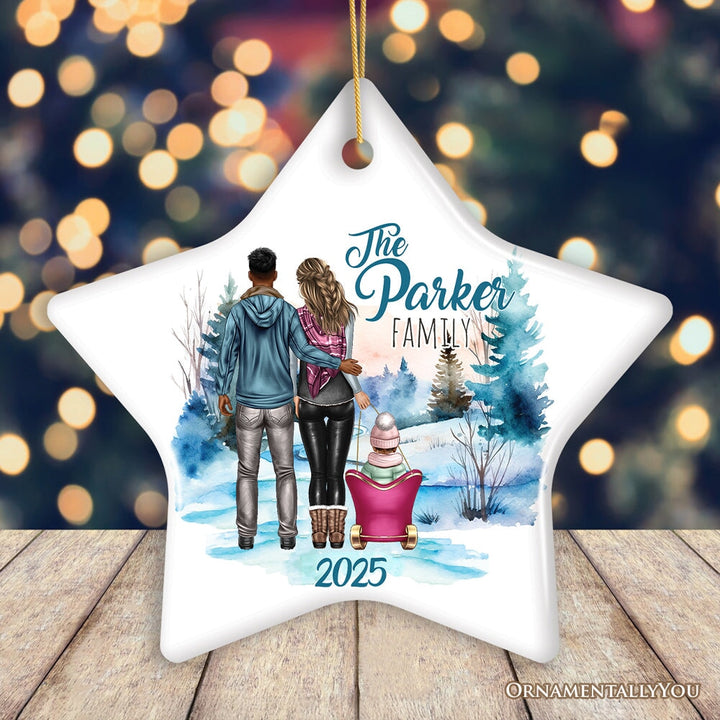 Family of Three Winter Holiday Personalized Gift, Parents & Baby on Sleigh Custom Christmas Ornament Ceramic Ornament OrnamentallyYou
