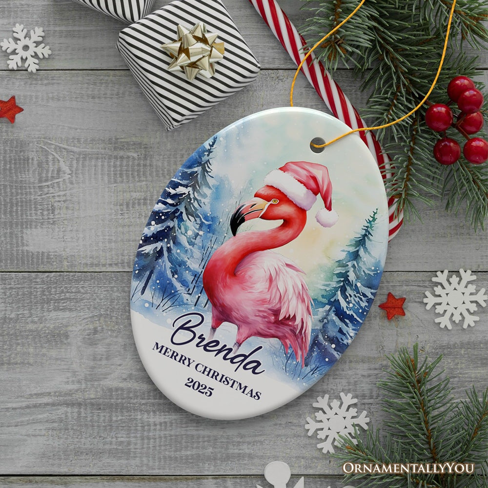 Flamingo with Santa Hat Personalized Ornament, Winter Forest Christmas Gift With Custom Name and Date Ceramic Ornament OrnamentallyYou Oval