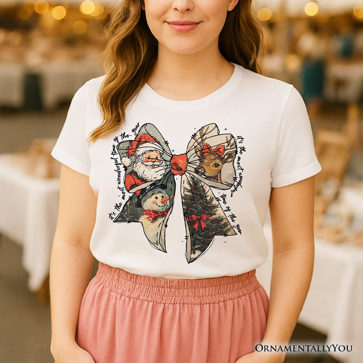 Coquette Christmas Bow T‑Shirt, It's Most Wonderful Time Of The Year Vintage Tee With Santa, Deer and Snowman T-Shirts OrnamentallyYou