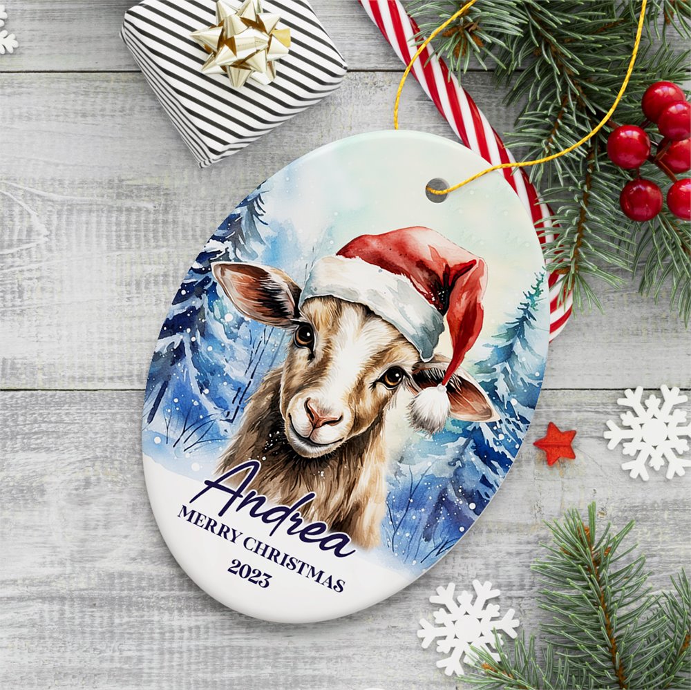 Goat with Santa Hat Personalized Ornament, Winter Forest Christmas Gift With Custom Name and Date Ceramic Ornament OrnamentallyYou Oval 
