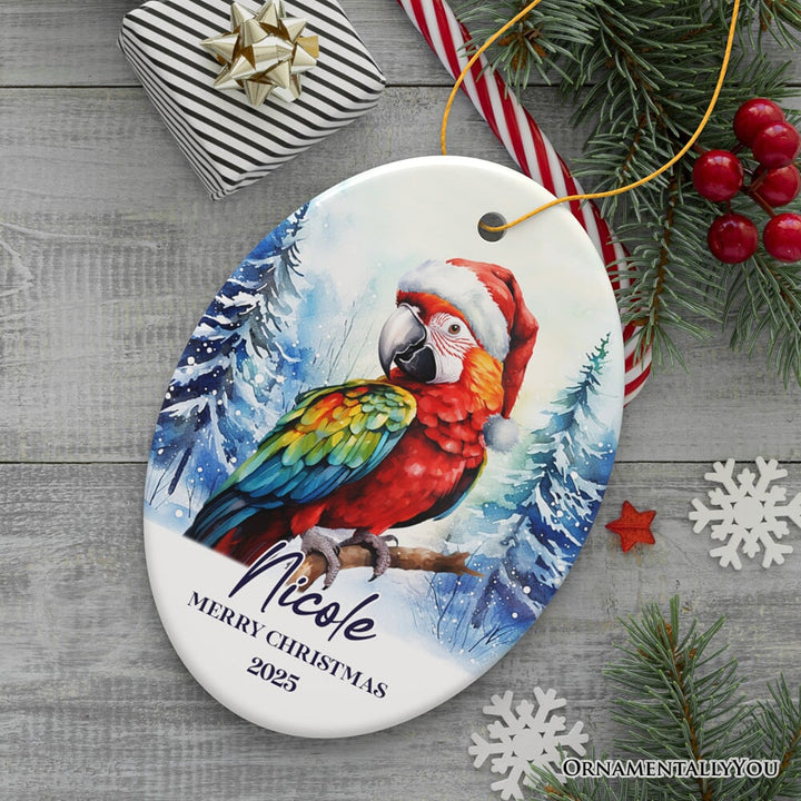 Macaw Parrot with Santa Hat Personalized Ornament, Winter Forest Christmas Gift With Custom Name and Date Ceramic Ornament OrnamentallyYou Oval 