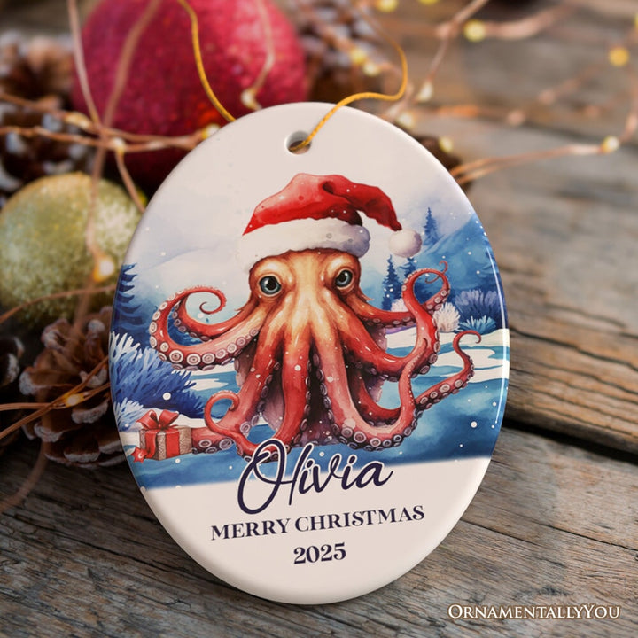 Octopus with Santa Hat Personalized Ornament, Festive Christmas Gift With Custom Name and Date Ceramic Ornament OrnamentallyYou Oval 