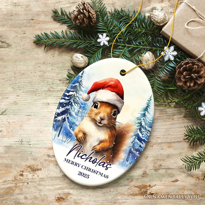 Squirrel with Santa Hat Personalized Ornament, Winter Forest Christmas Gift With Custom Name and Date Ceramic Ornament OrnamentallyYou Oval 