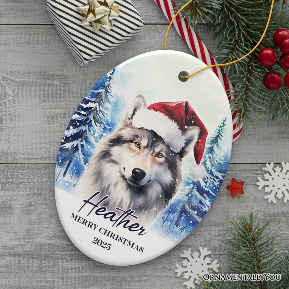 Wolf with Santa Hat Personalized Ornament, Winter Forest Christmas Gift With Custom Name and Date Ceramic Ornament OrnamentallyYou Oval 