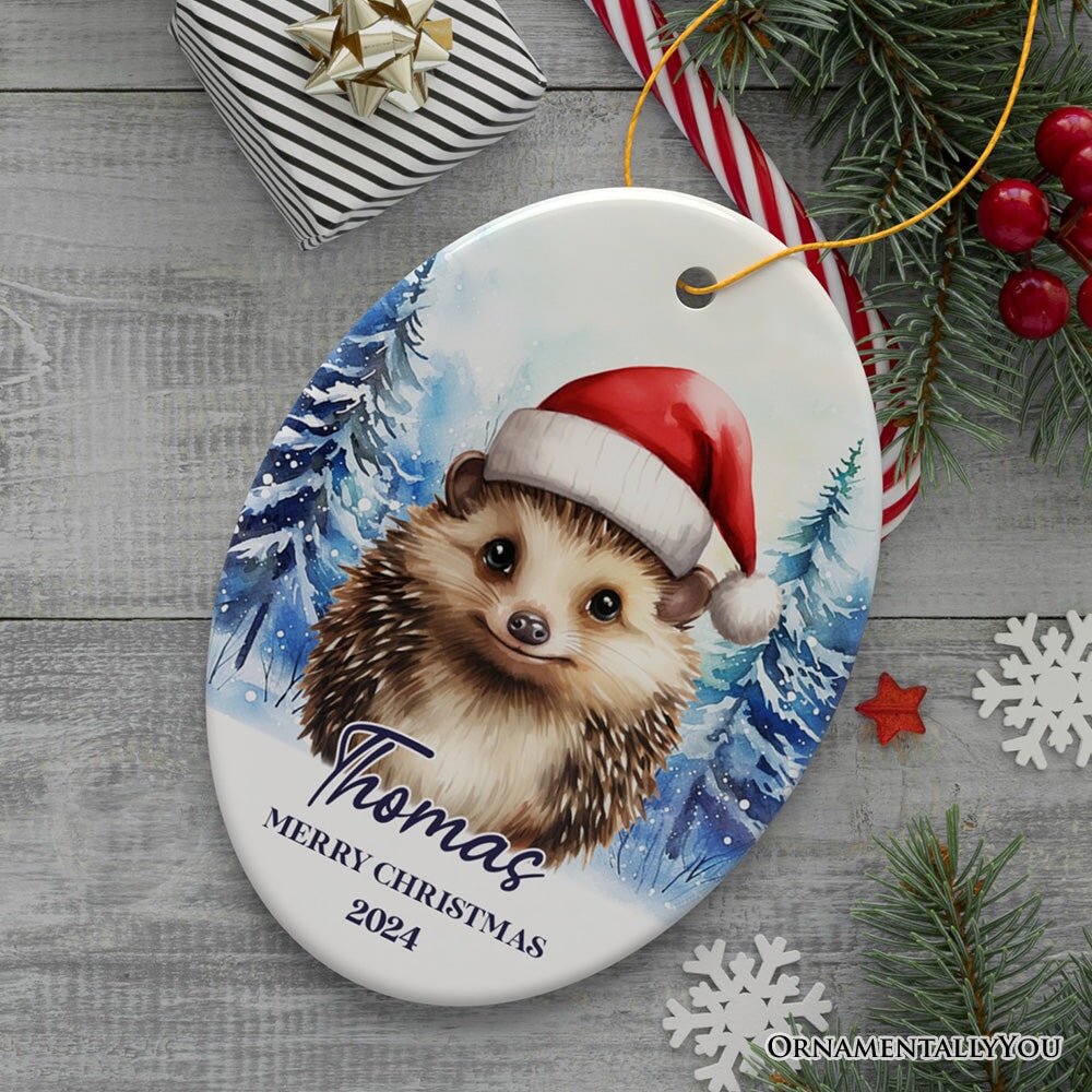 Hedgehog with Santa Hat Personalized Ornament, Winter Forest Christmas Gift With Custom Name and Date Ceramic Ornament OrnamentallyYou Oval 