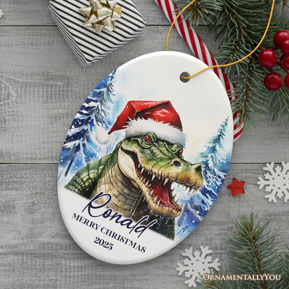 Alligator with Santa Hat Personalized Ornament, Winter Forest Christmas Gift With Custom Name and Date Ceramic Ornament OrnamentallyYou Oval 