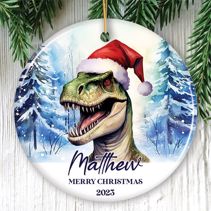 Dinosaur with Santa Hat Personalized Ornament, Winter Forest Christmas Gift With Custom Name and Date Ceramic Ornament OrnamentallyYou Circle 