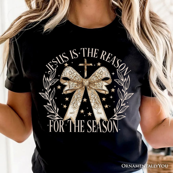 Jesus Is the Reason Christmas T‑Shirt, Coquette Gold Bow Cross Tee for Faithful Women T-Shirts OrnamentallyYou 