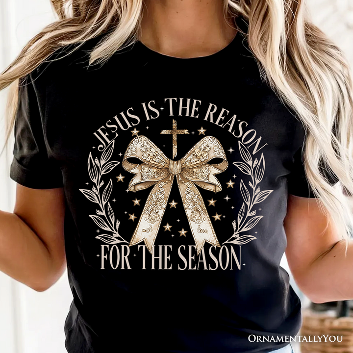 Jesus Is the Reason Christmas T‑Shirt, Coquette Gold Bow Cross Tee for Faithful Women
