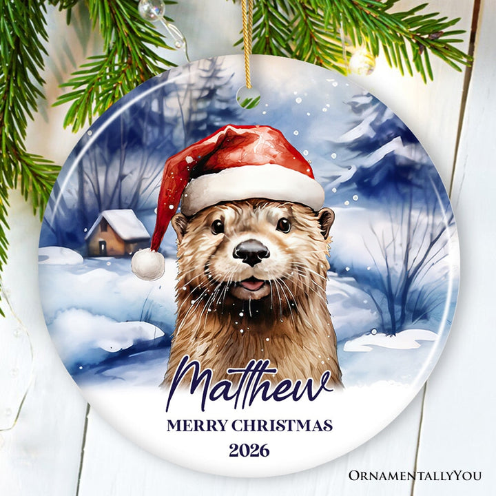 Otter with Santa Hat Personalized Ornament, Festive Christmas Gift With Custom Name and Date Ceramic Ornament OrnamentallyYou Circle 