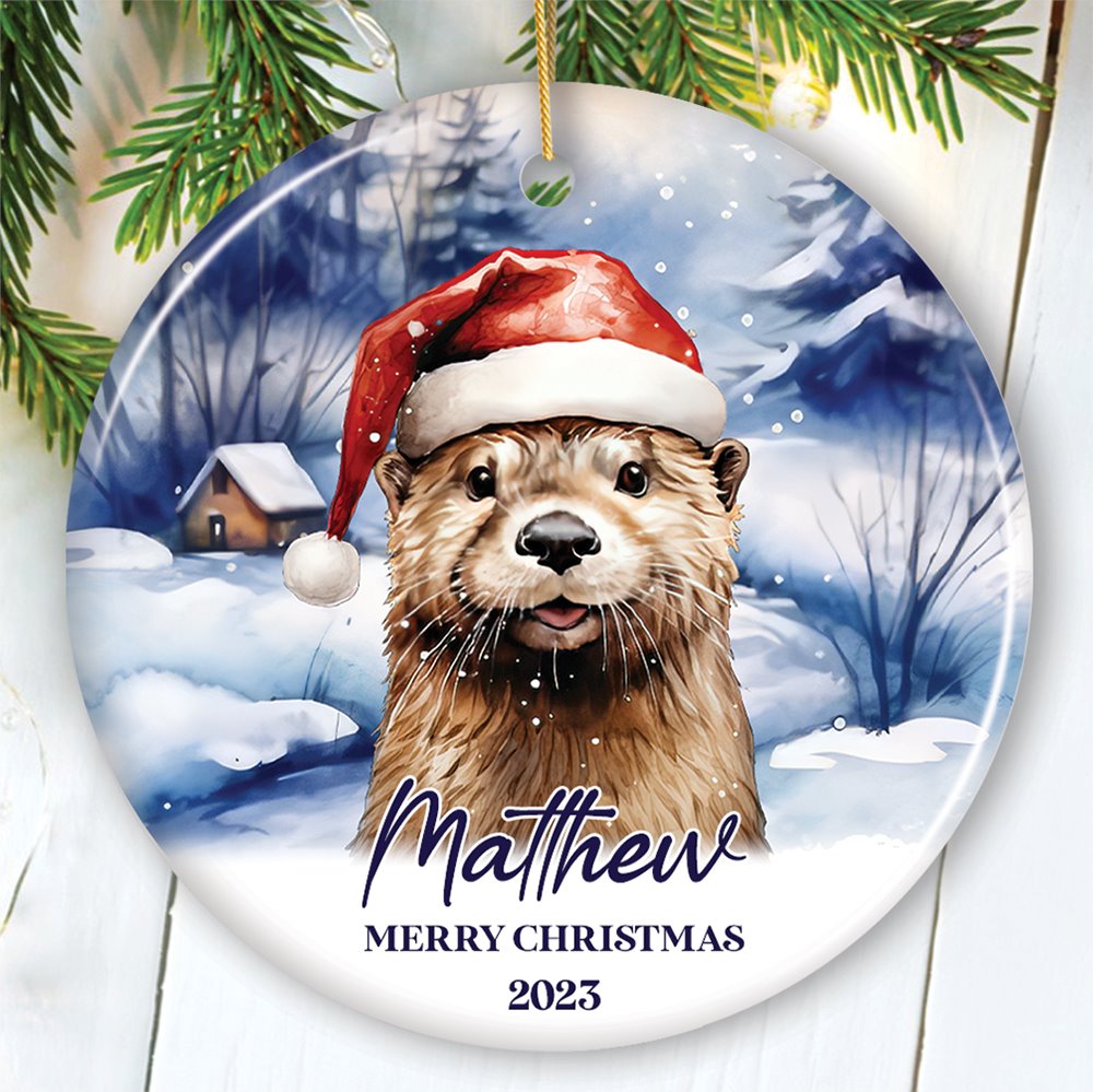 Otter with Santa Hat Personalized Ornament, Festive Christmas Gift With Custom Name and Date Ceramic Ornament OrnamentallyYou Circle 