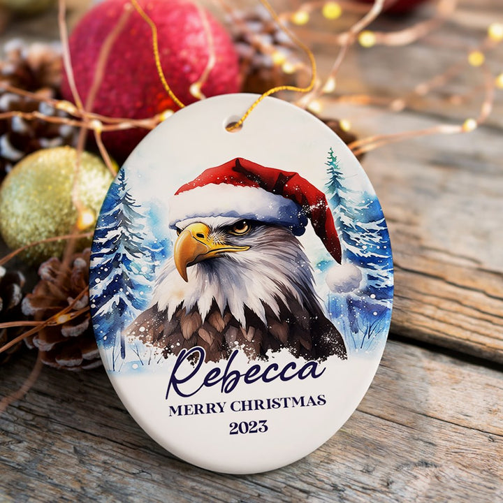 American Bald Eagle with Santa Hat Personalized Ornament, Winter Forest Christmas Gift With Custom Name and Date Ceramic Ornament OrnamentallyYou Oval 