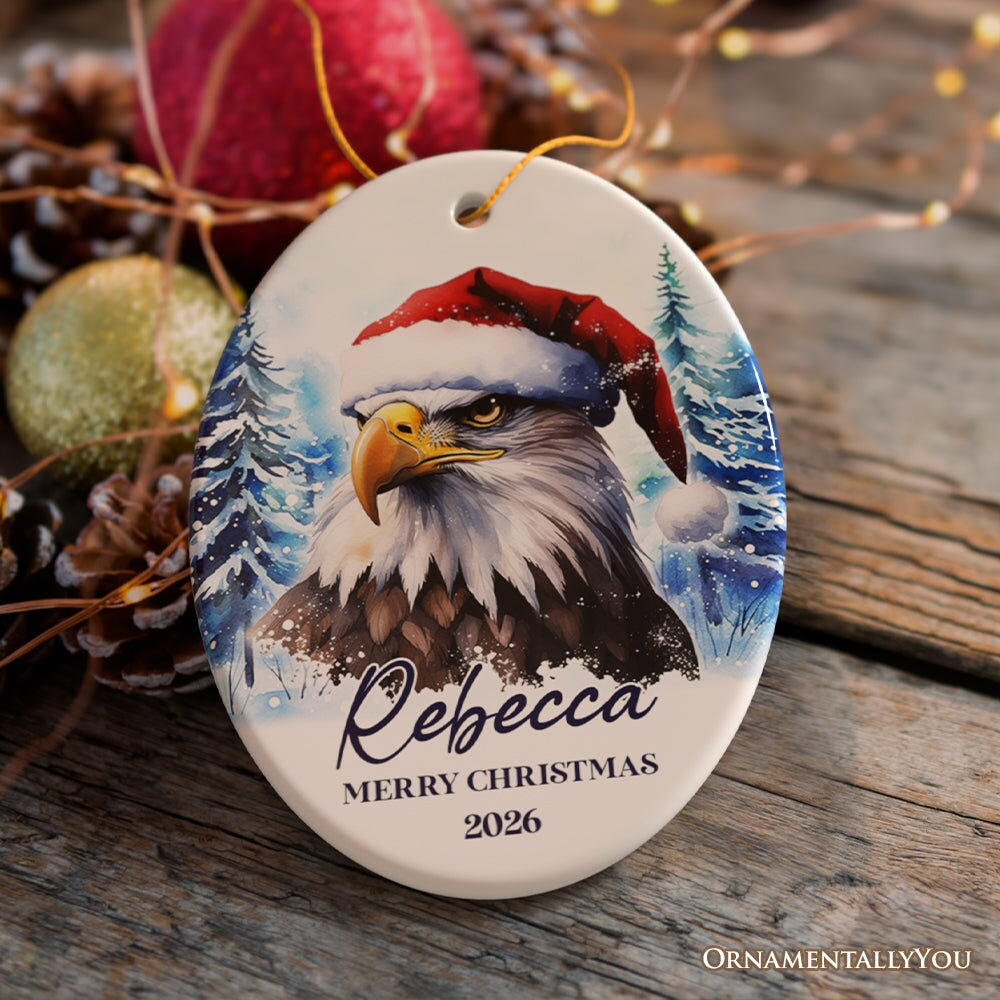 American Bald Eagle with Santa Hat Personalized Ornament, Winter Forest Christmas Gift With Custom Name and Date Ceramic Ornament OrnamentallyYou Oval 