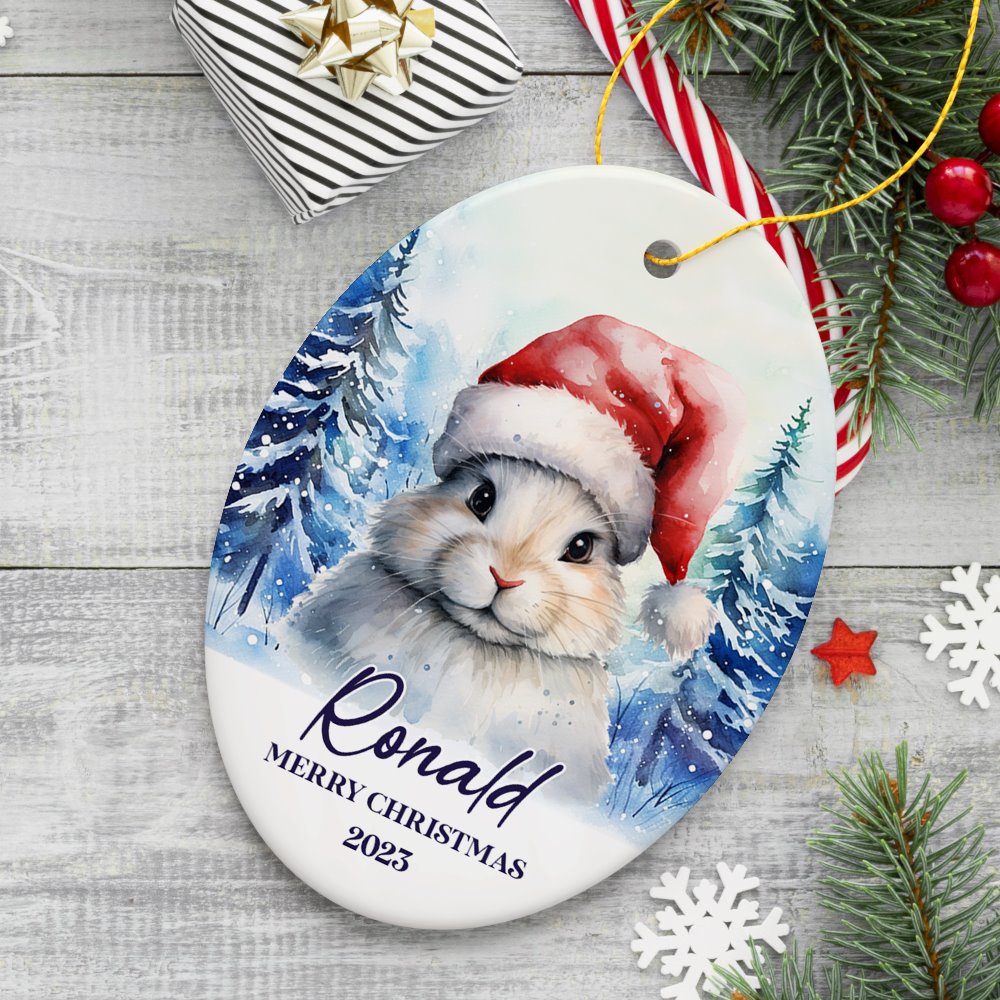 Cute Bunny with Santa Hat Personalized Ornament, Winter Forest Christmas Gift With Custom Name and Date Ceramic Ornament OrnamentallyYou Oval 