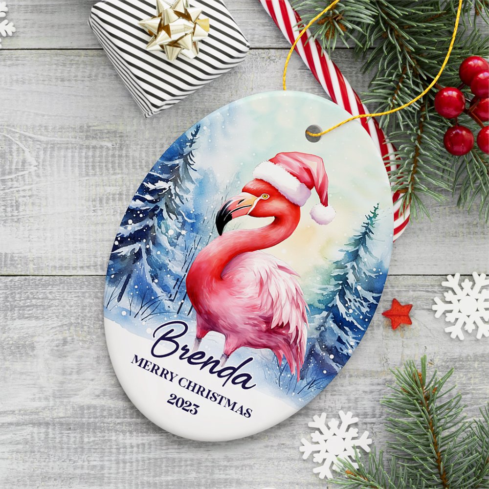 Flamingo with Santa Hat Personalized Ornament, Winter Forest Christmas Gift With Custom Name and Date Ceramic Ornament OrnamentallyYou Oval 