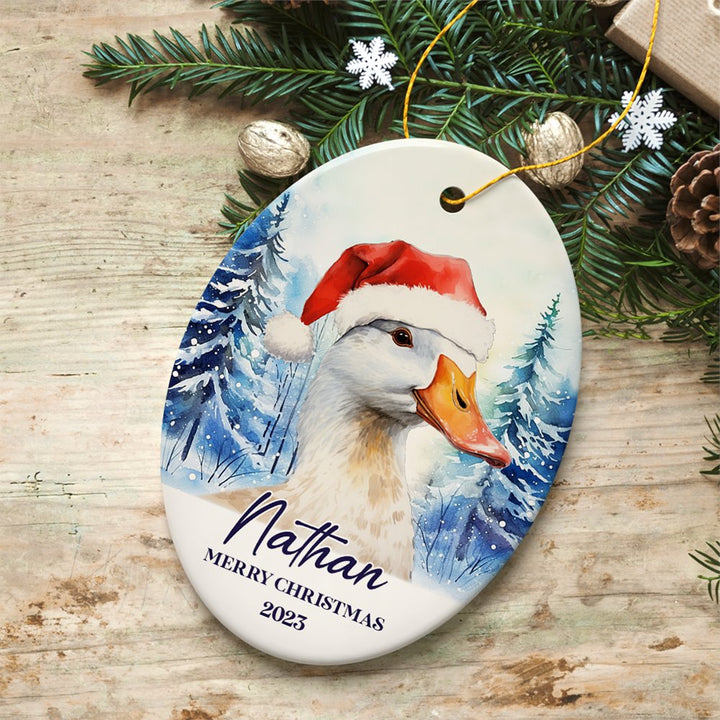 Goose with Santa Hat Personalized Ornament, Winter Forest Christmas Gift With Custom Name and Date Ceramic Ornament OrnamentallyYou Oval 