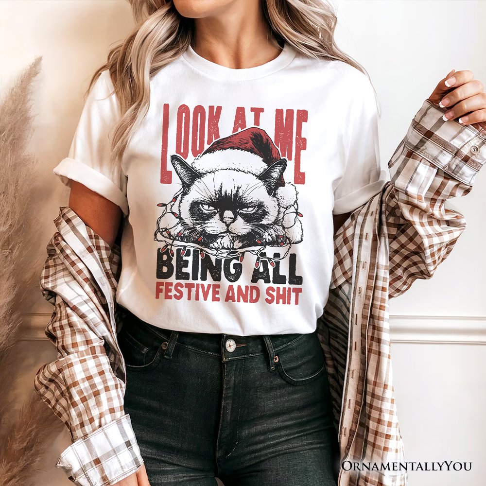 Grumpy Christmas Cat T‑Shirt, Funny Santa Hat Holiday Lights Tee for Sarcastic Festive People T-Shirts OrnamentallyYou 