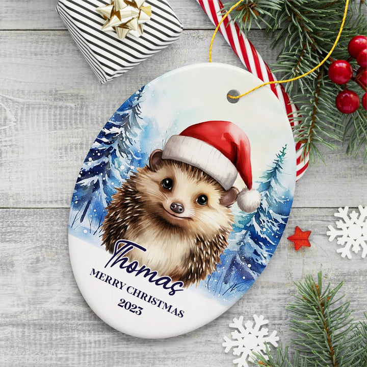 Hedgehog with Santa Hat Personalized Ornament, Winter Forest Christmas Gift With Custom Name and Date Ceramic Ornament OrnamentallyYou Oval 