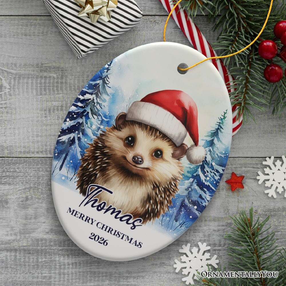Hedgehog with Santa Hat Personalized Ornament, Winter Forest Christmas Gift With Custom Name and Date Ceramic Ornament OrnamentallyYou Oval 