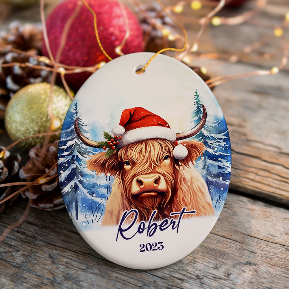 Highland Cow Personalized Ornament, Enchanted Frost Christmas Gift With Custom Name and Date Ceramic Ornament OrnamentallyYou Oval 