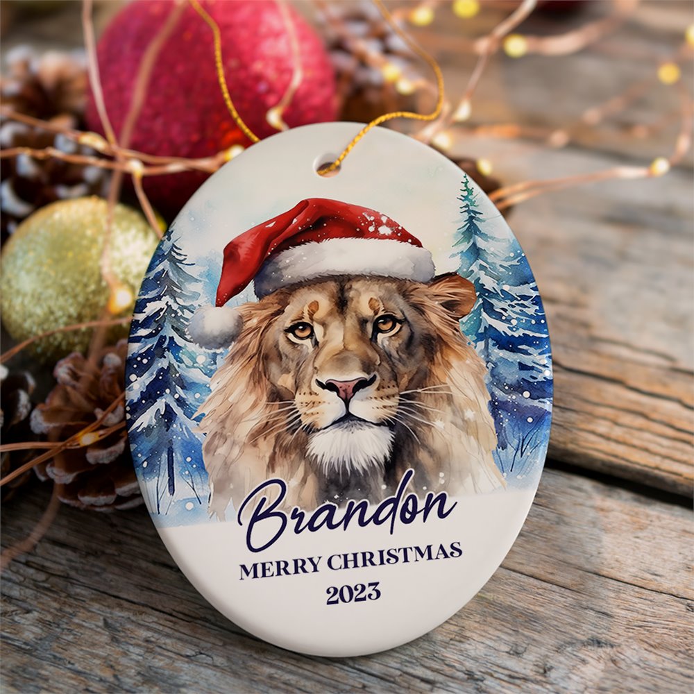 Lion with Santa Hat Personalized Ornament, Winter Forest Christmas Gift With Custom Name and Date Ceramic Ornament OrnamentallyYou Oval 
