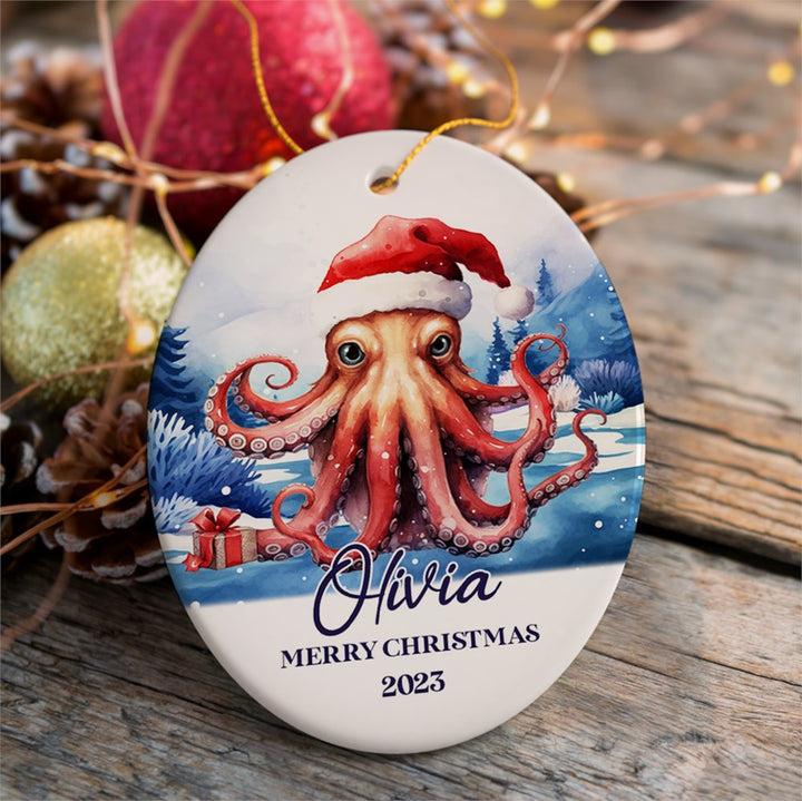Octopus with Santa Hat Personalized Ornament, Festive Christmas Gift With Custom Name and Date Ceramic Ornament OrnamentallyYou Oval 