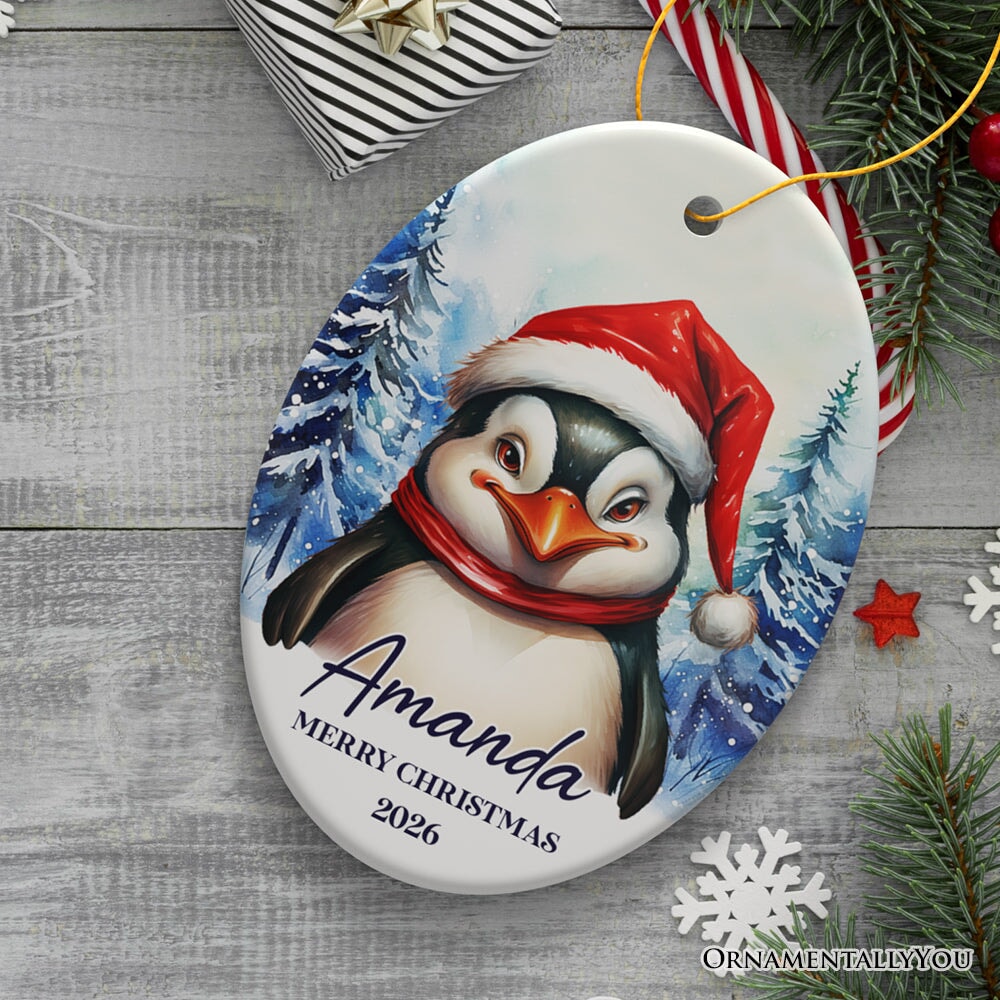 Penguin with Santa Hat Personalized Ornament, Winter Forest Christmas Gift With Custom Name and Date Ceramic Ornament OrnamentallyYou Oval 