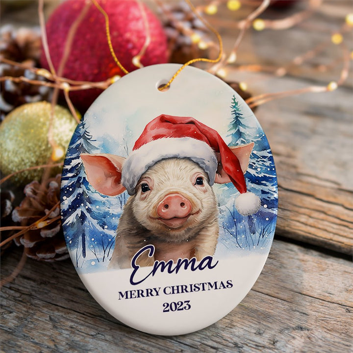 Pig with Santa Hat Personalized Ornament, Winter Forest Christmas Gift With Custom Name and Date Ceramic Ornament OrnamentallyYou Oval 