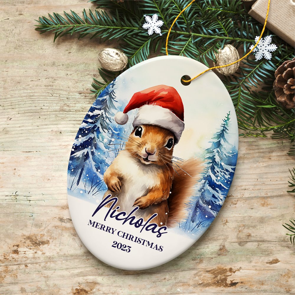 Squirrel with Santa Hat Personalized Ornament, Winter Forest Christmas Gift With Custom Name and Date Ceramic Ornament OrnamentallyYou Oval 