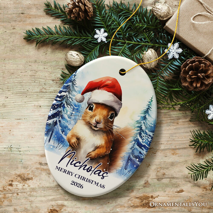 Squirrel with Santa Hat Personalized Ornament, Winter Forest Christmas Gift With Custom Name and Date Ceramic Ornament OrnamentallyYou Oval 