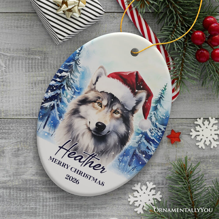 Wolf with Santa Hat Personalized Ornament, Winter Forest Christmas Gift With Custom Name and Date Ceramic Ornament OrnamentallyYou Oval 