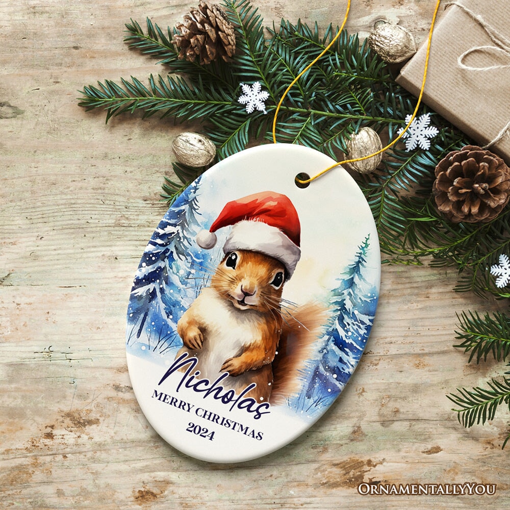 Squirrel with Santa Hat Personalized Ornament, Winter Forest Christmas Gift With Custom Name and Date Ceramic Ornament OrnamentallyYou Oval 