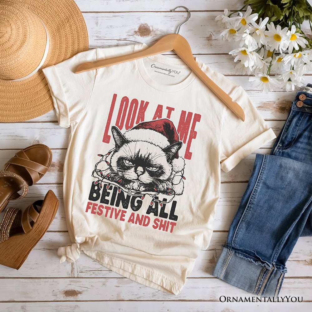 Grumpy Christmas Cat T‑Shirt, Funny Santa Hat Holiday Lights Tee for Sarcastic Festive People T-Shirts OrnamentallyYou Natural XS 