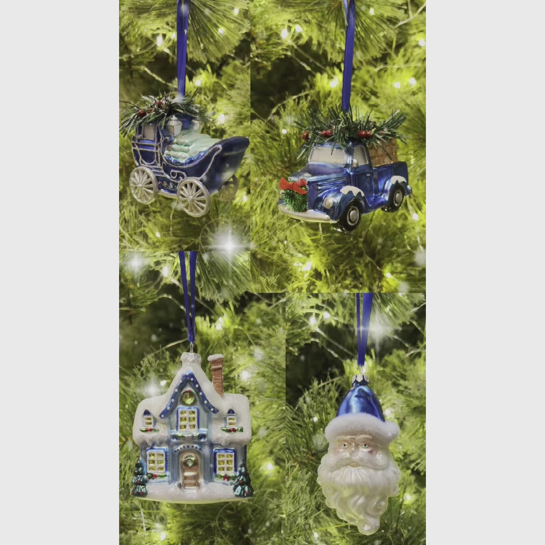 A Marvelous Blue Christmas Set of Four Glass Ornaments with Santa, Truck, Snow Cabin and Sleigh