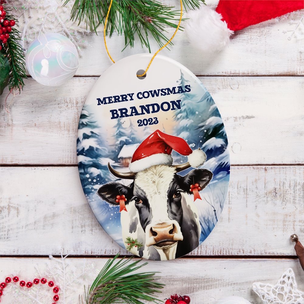Personalized Watercolor Christmas Cow Ornament, Farmhouse Festive Merry Cowsmas Gift Ceramic Ornament OrnamentallyYou Oval 